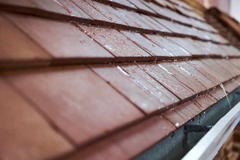 Wet roof shingles showing water protection