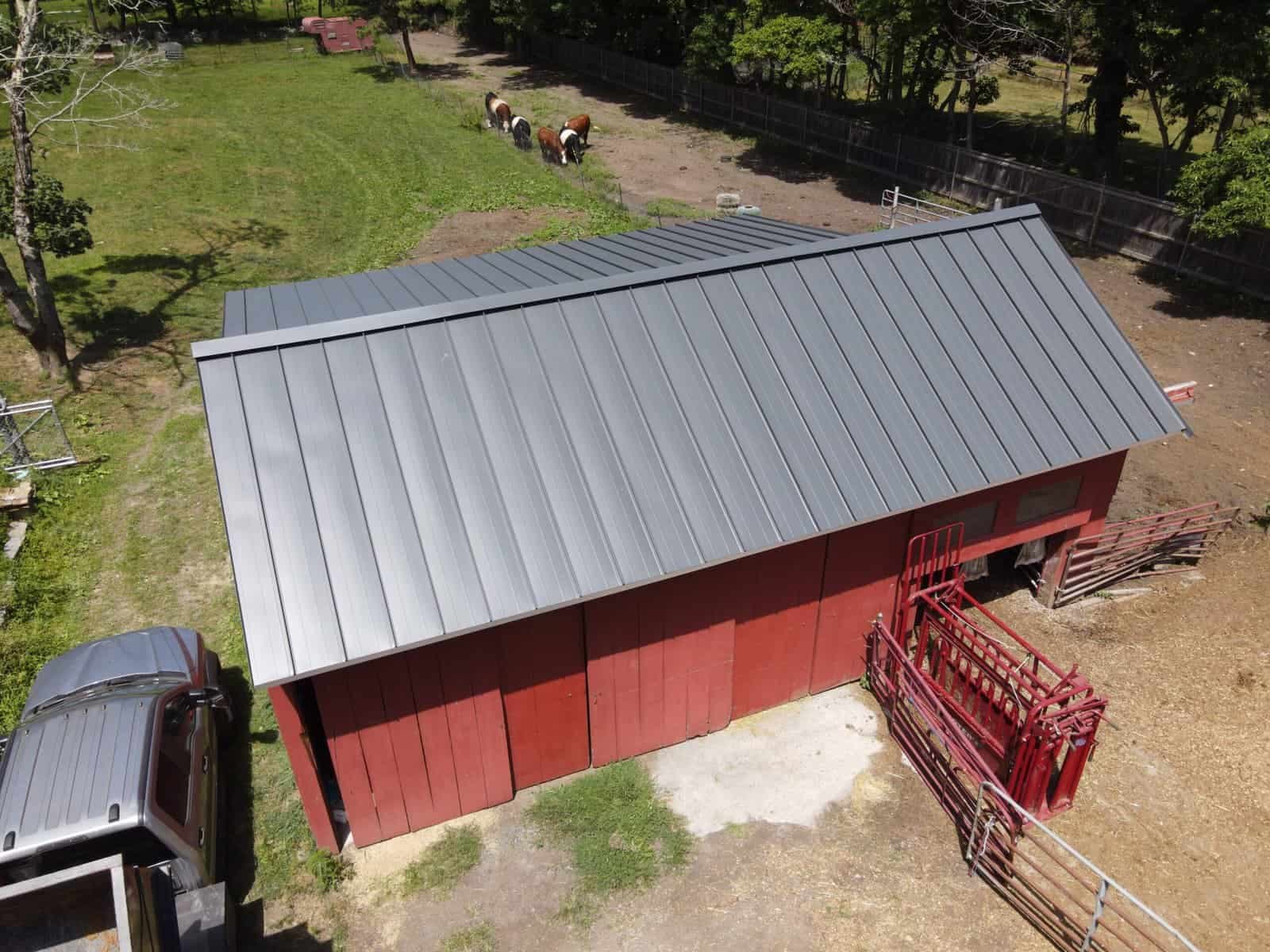 Aerial view of home with new metal roof