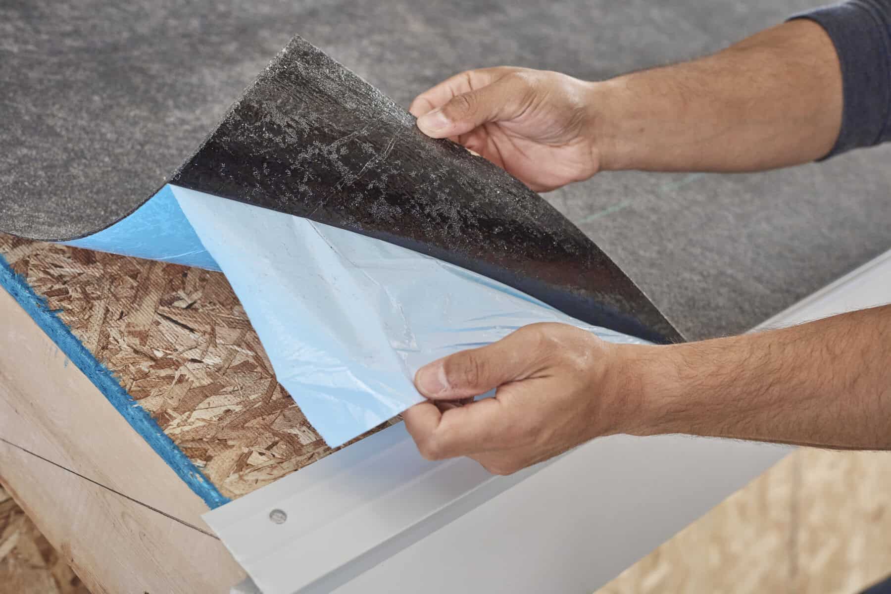 WinterGuard ice and water barrier being installed on roof deck