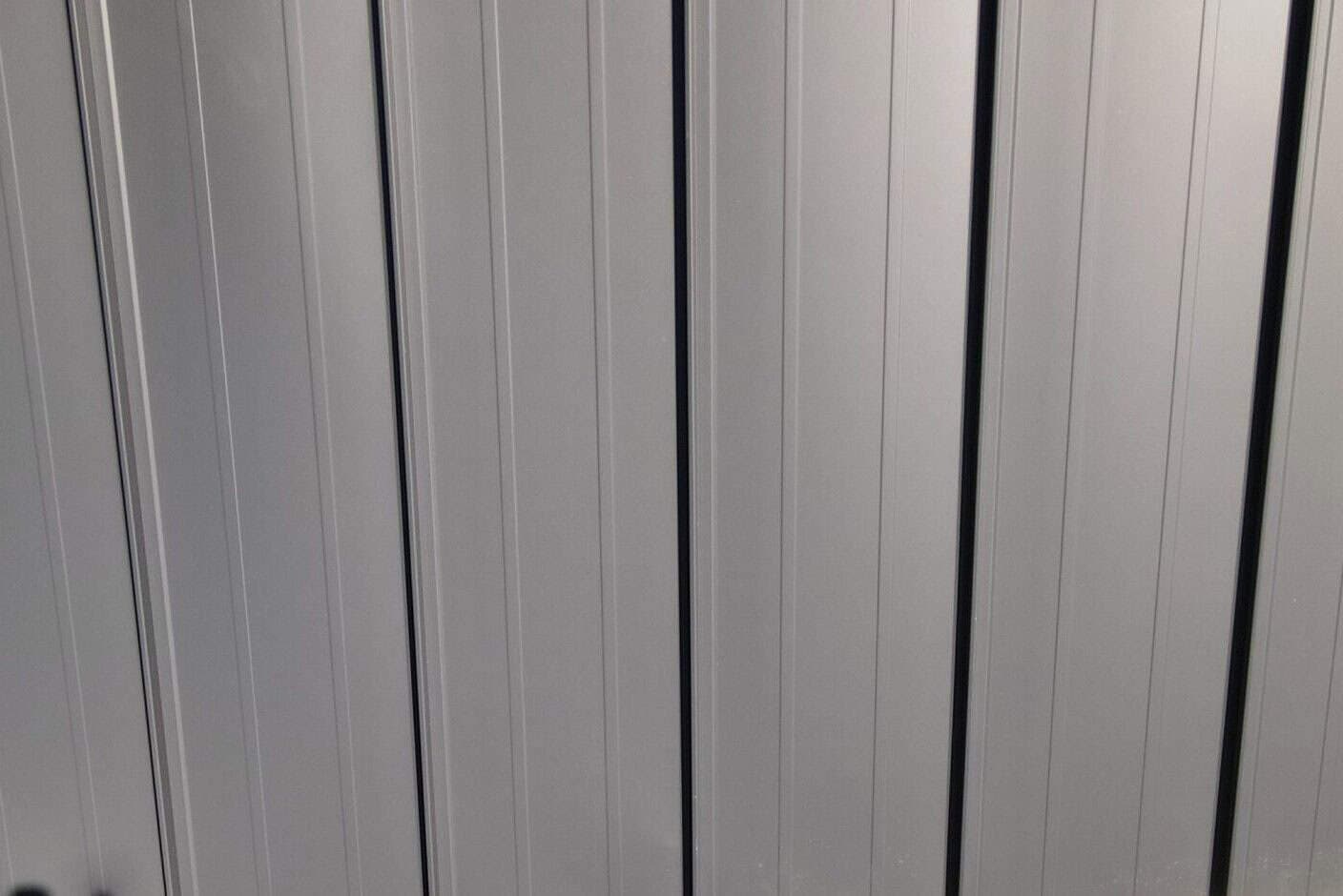 Standing seam metal panels installed on residential roof