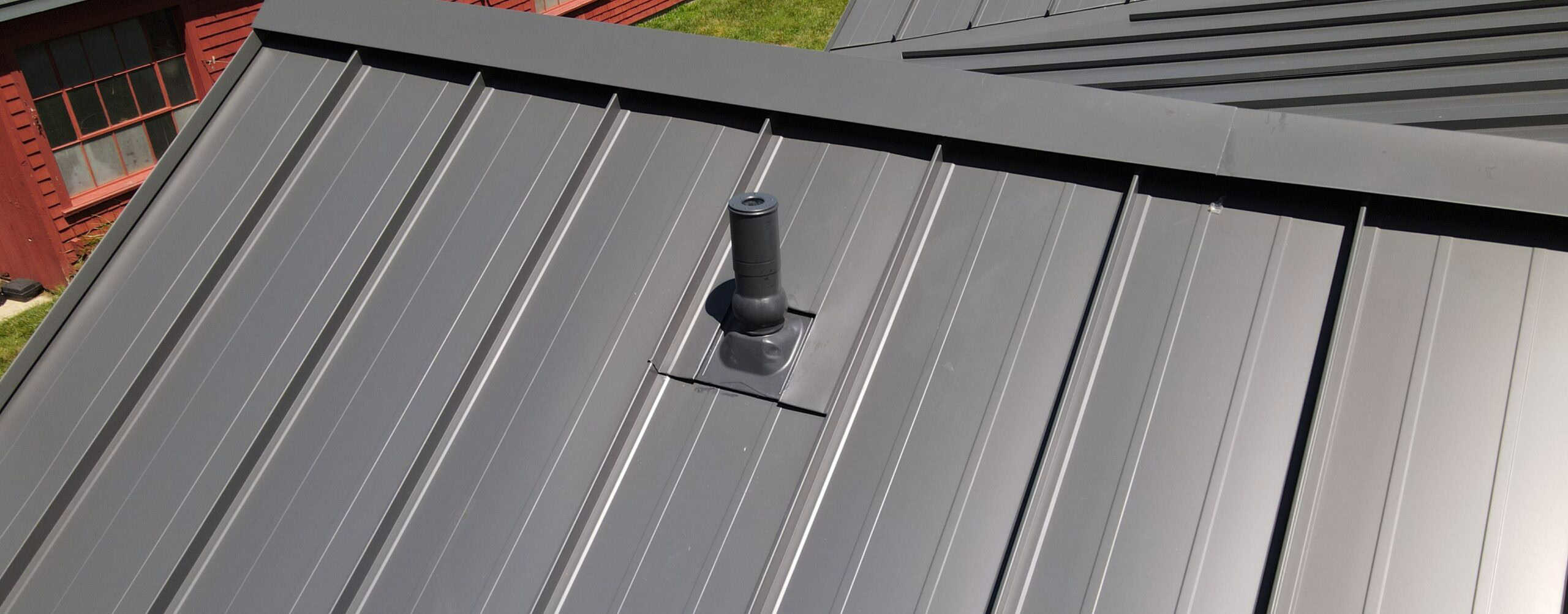 Z-closure ventilation components on metal roof