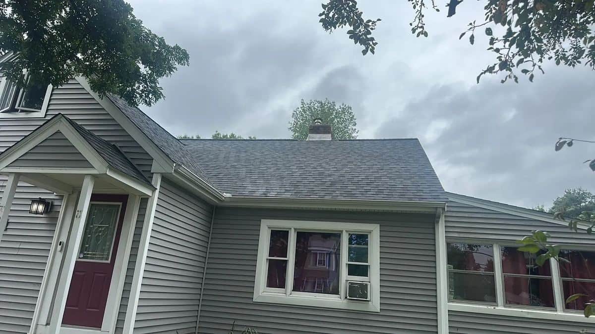 Gray cape-style home in Billerica, MA with a newly installed gray shingle roof