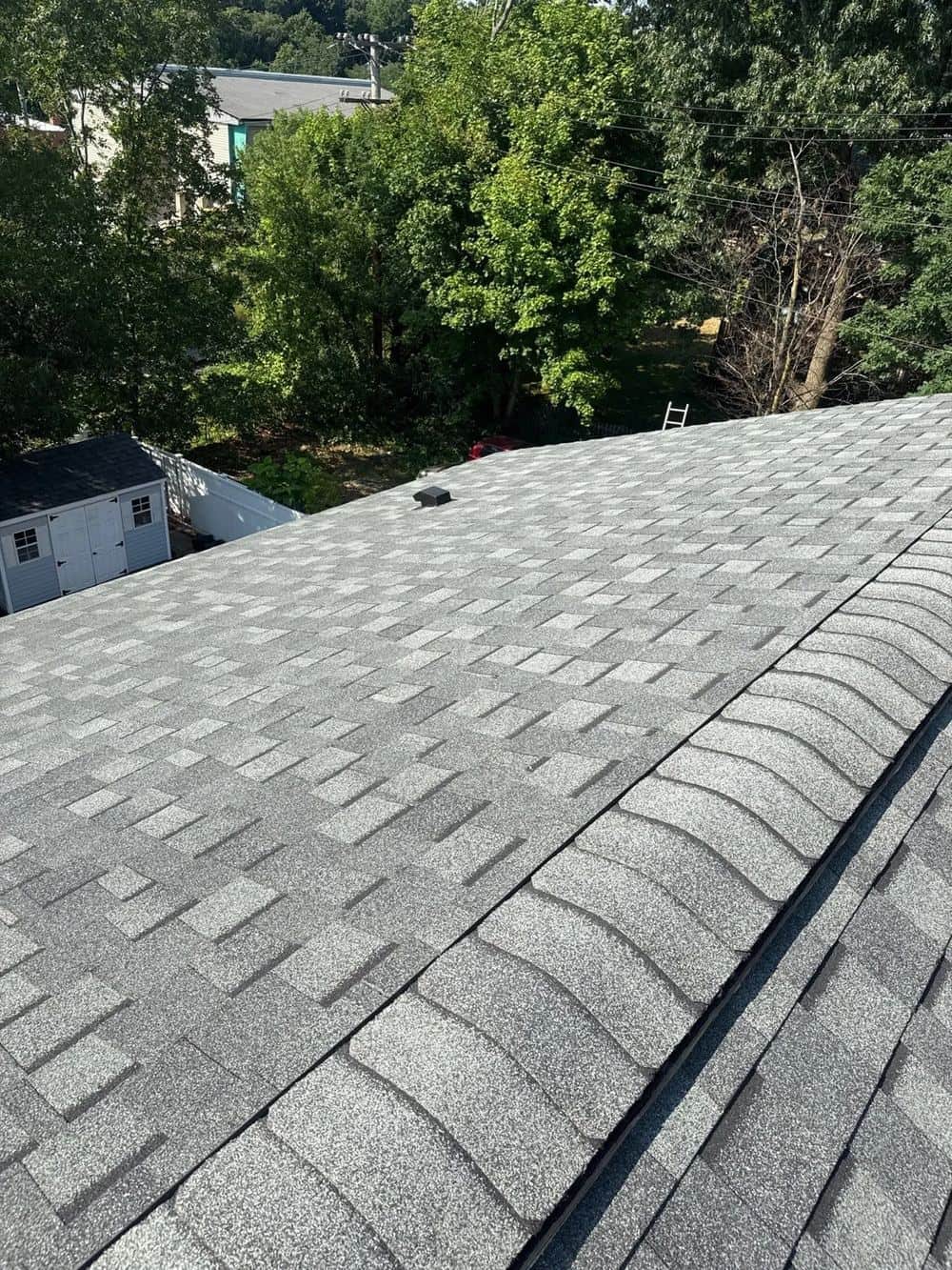 Close-up of new gray architectural shingles on a Hyde Park, MA roof