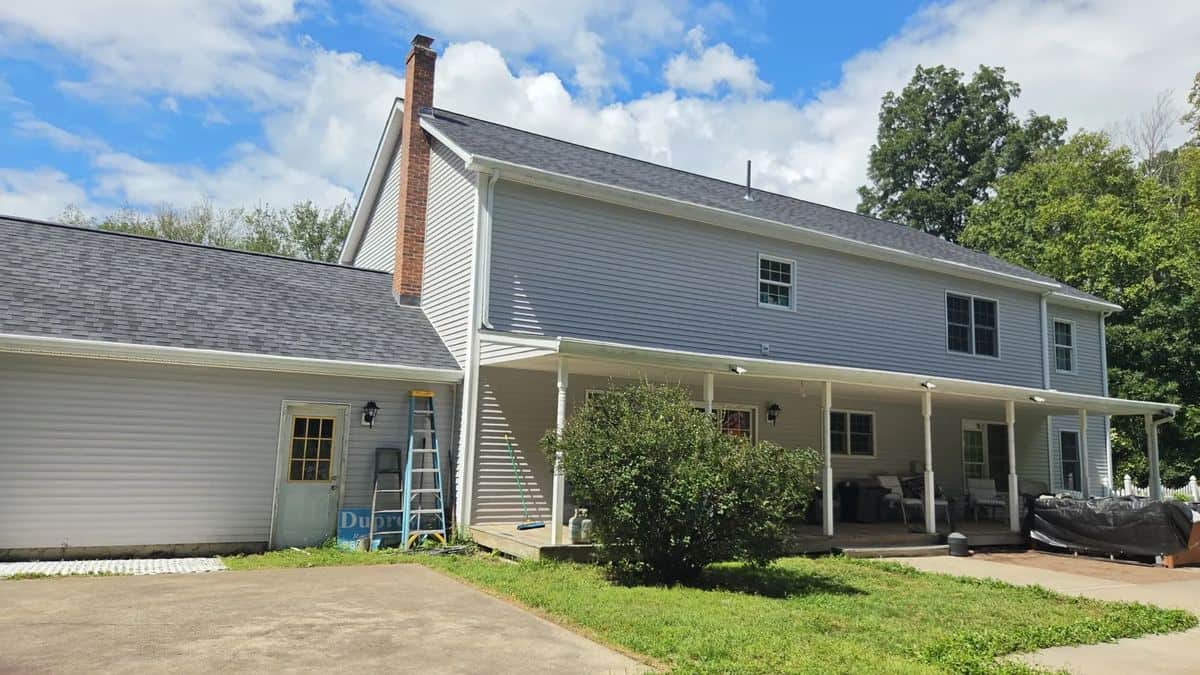Rear of a colonial in Pomfret Center, CT with a new gray shingle roof