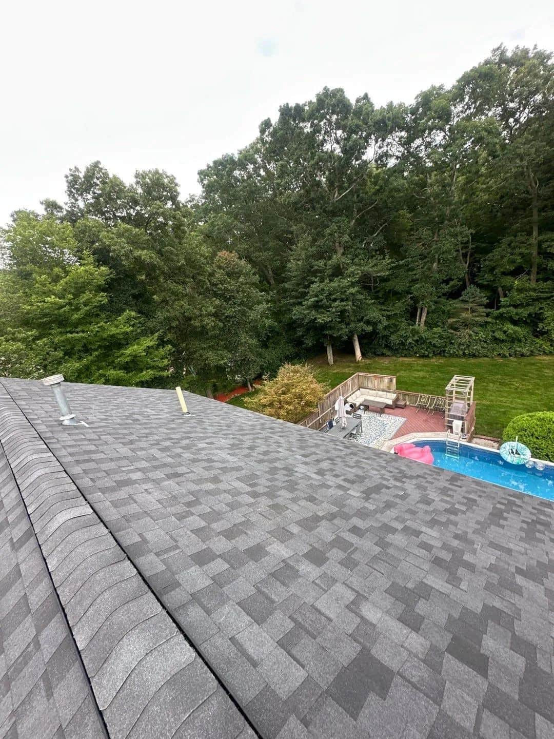 New gray shingle roof in Somerset, MA overlooking a backyard pool
