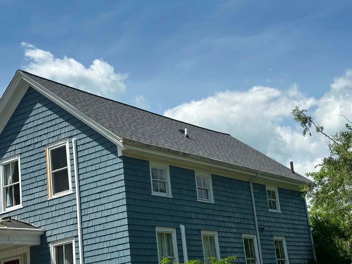 Blue shake-sided home in Swansea, MA with a new gray shingle roof