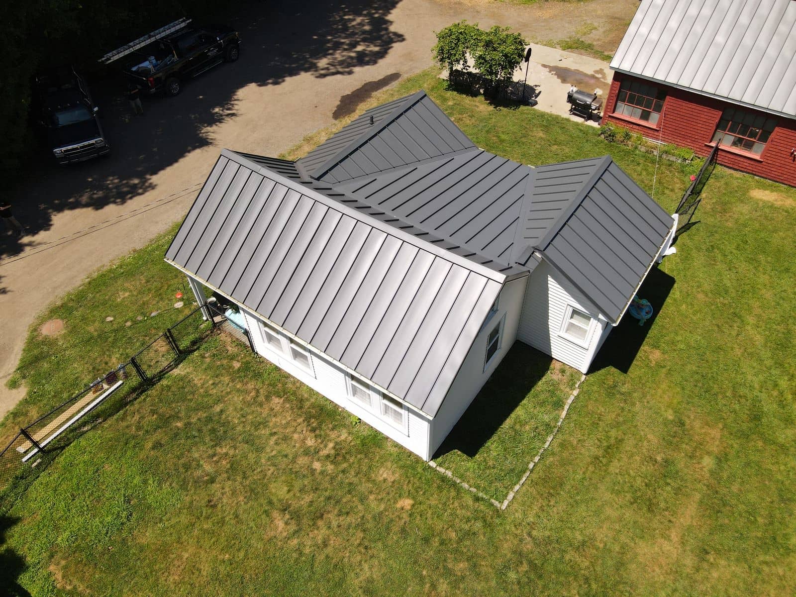 Aerial view of the finished Winters Farm house in Rehoboth, MA with its new charcoal standing-seam metal roof