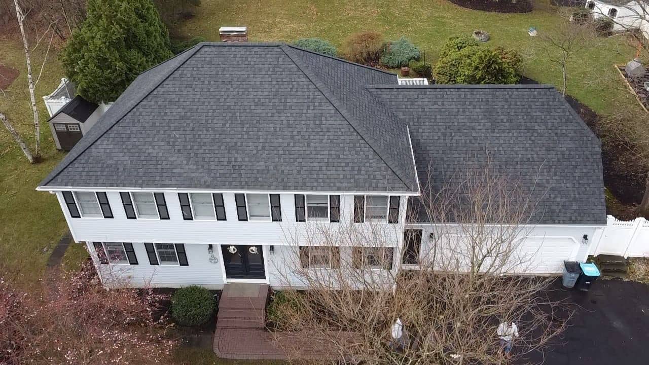 Completed roof replacement on the Shrewsbury, MA home with new CertainTeed Landmark architectural shingles