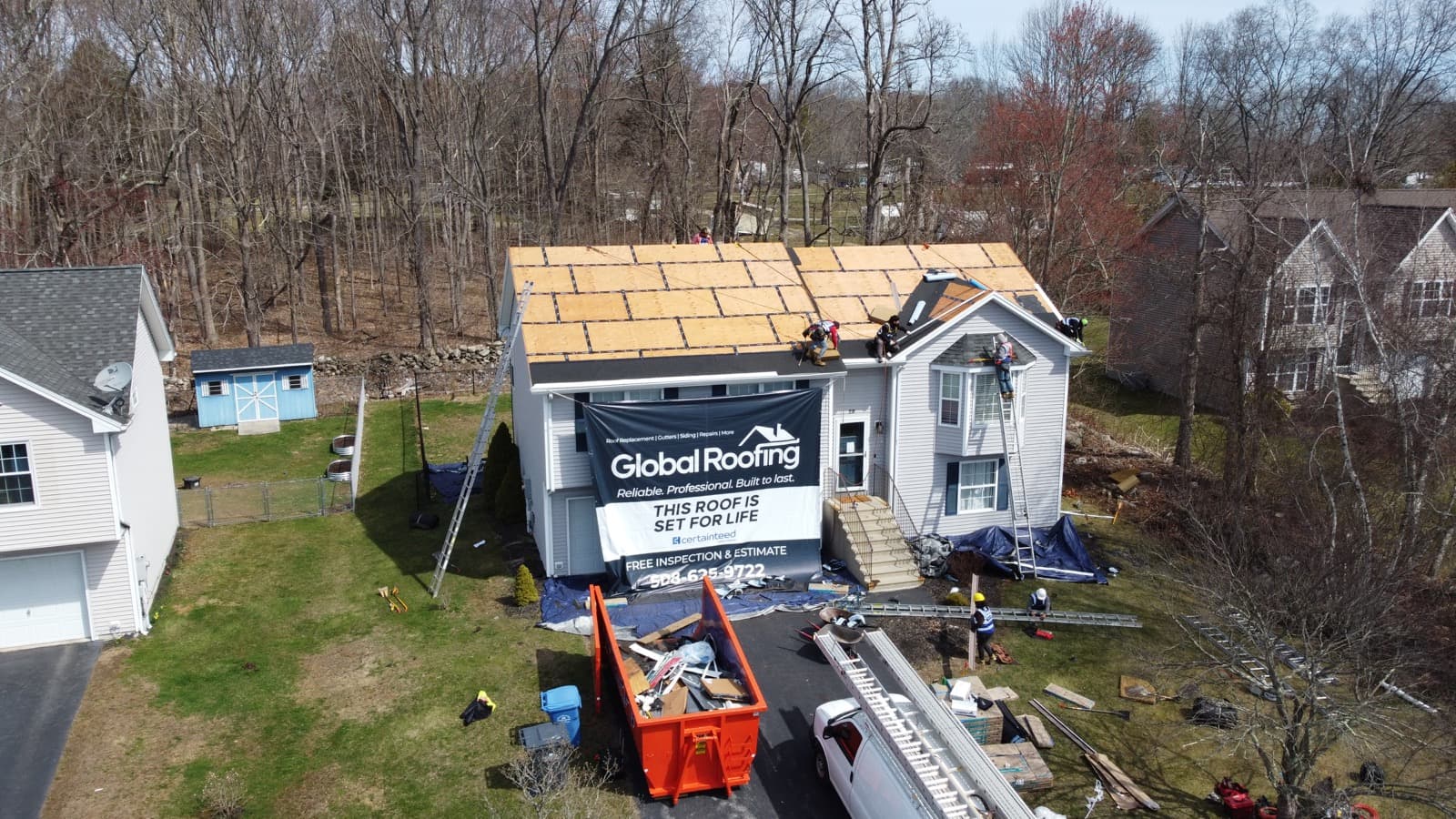 Synthetic underlayment going down on the deck during a Global Roofing 1-day install