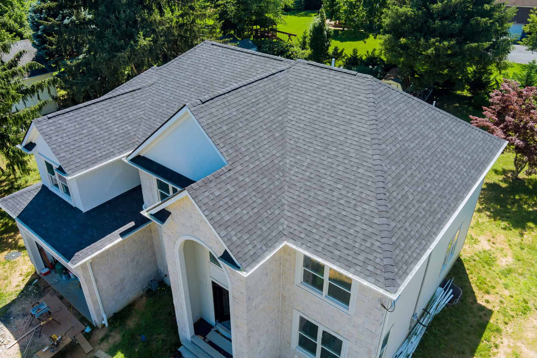 Aerial view of home with new asphalt shingle roof