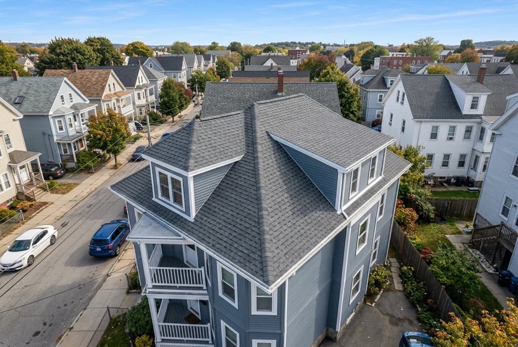 New architectural shingle roof on a Lowell, Massachusetts triple-decker home