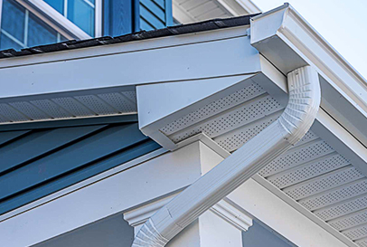 Close-up of a home's gutter and soffit system, showcasing expert installation for efficient water drainage and roof protection.