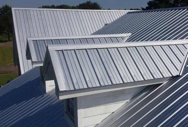 Modern home with a sleek, durable metal roofing system, providing energy efficiency and long-lasting weather protection.