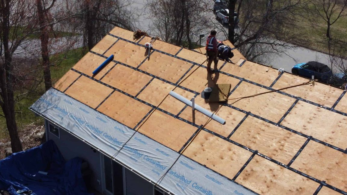 New roof installation with advanced waterproof underlayment for New England weather resistance.